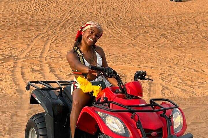 Evening Dubai Desert Safari: Dune Bashing, Camel Ride & Camp Dinner