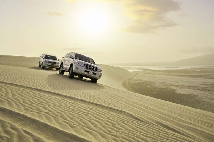 Half-Day Desert Safari & Inland Sea from Doha — Dune Bashing, Sandboarding & Camel Ride photo 1