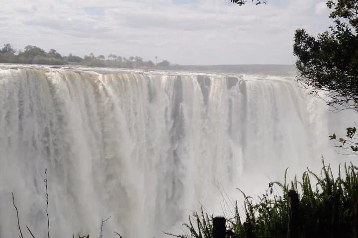 See Both Sides of Victoria Falls: Helicopter, Falls Walks & Livingstone/Livingstone Combo photo 1