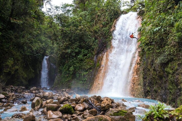 Blue Falls Canyoning: 4 Rappels, Natural Slides & Celestial Pools Near La Fortuna photo 1