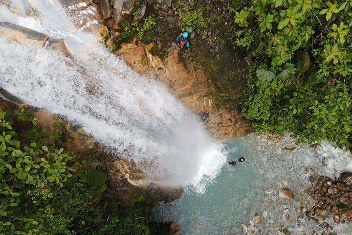 Blue Falls Canyoning: 4 Rappels, Natural Slides & Celestial Pools Near La Fortuna photo 3