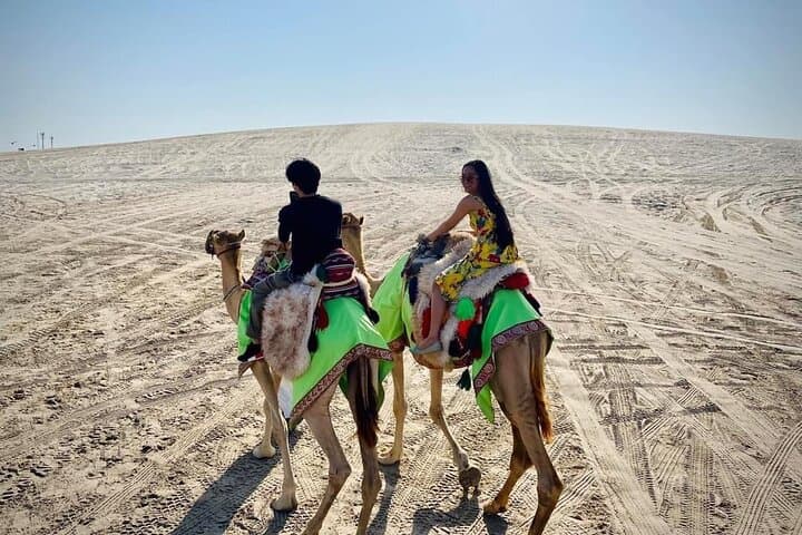 Sunset Camel Trekking on Qatar's Sealine Dunes photo 3