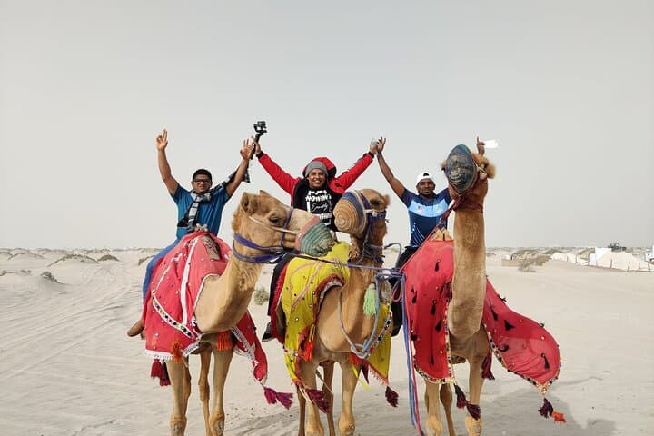 Sunset Camel Trekking on Qatar's Sealine Dunes photo 6
