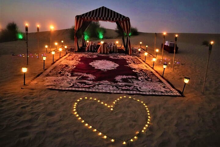Private Romantic Dubai Desert Dinner with Camel Ride, Dune Bashing & Falcons