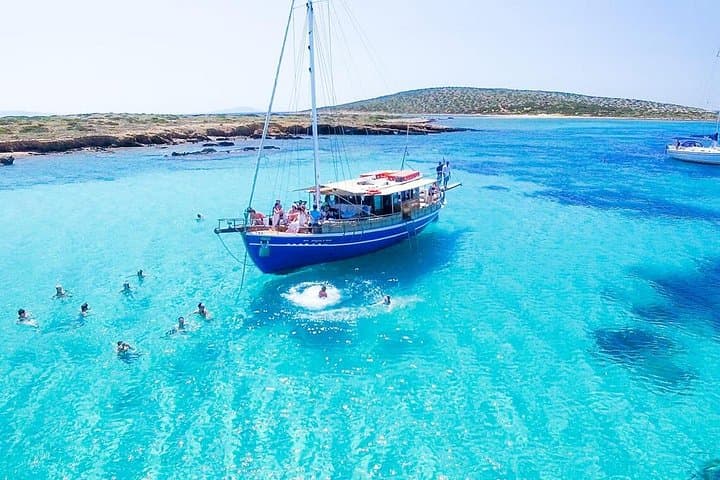 Antiparos & Despotiko Day Cruise from Paros — Swim Caves, Cliffs & Traditional Lunch photo 1