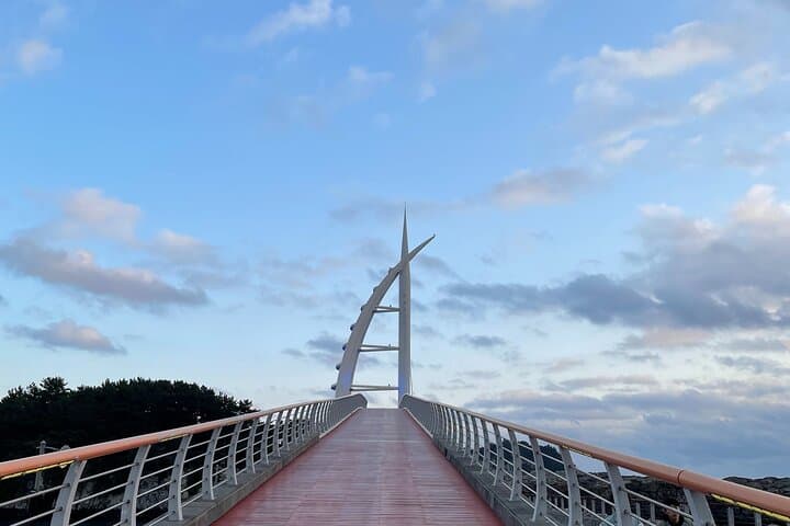 Seogwipo Sunset Walking Tour: Cheonjiyeon Falls, Saeseom & Olle Market photo 3