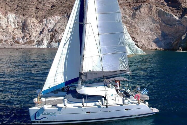 Santorini Catamaran Cruise: Red Beach, Hot Springs & BBQ Small-Group Sail