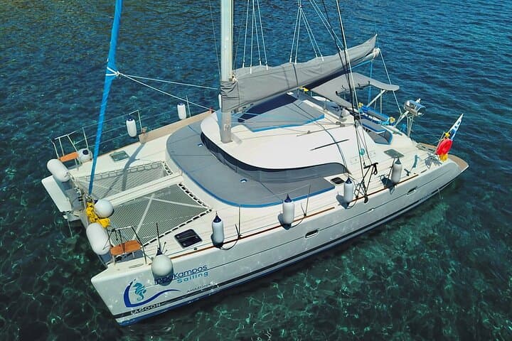 Santorini Catamaran Cruise: Red Beach, Hot Springs & BBQ Day Sail