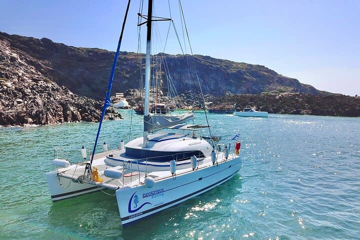 Full-Day Santorini Catamaran Cruise to Ios — Swim, BBQ & Caldera Sunset photo 1