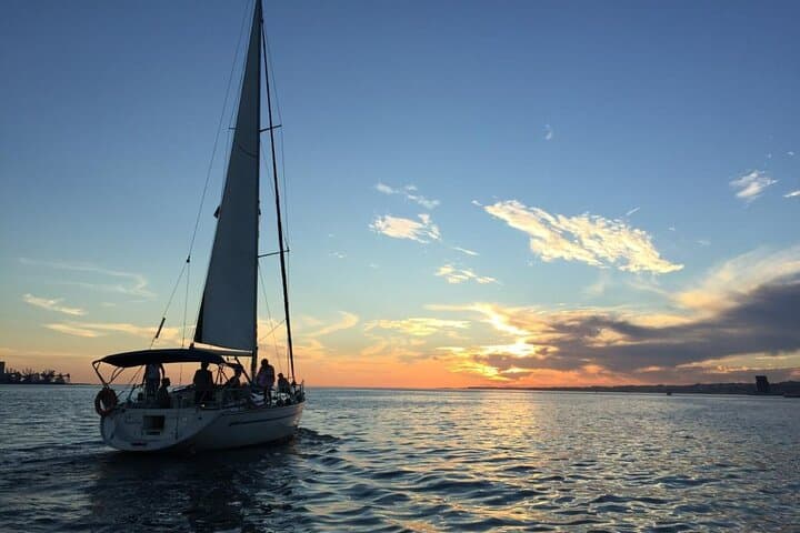 Sunset Sail on the Tagus: Private Lisbon Cruise with Drinks