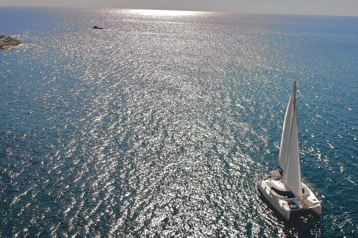 Santorini Catamaran Cruise: Red Beach, Hot Springs & BBQ Day Sail photo 2