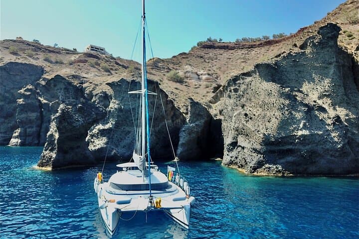 Santorini Catamaran Cruise: Red Beach, Hot Springs & BBQ Small-Group Sail photo 6