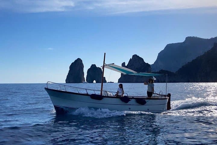 Private Full-Day Boat Tour Around the Capri Coast: Blue Grotto, Faraglioni & Snorkeling photo 1