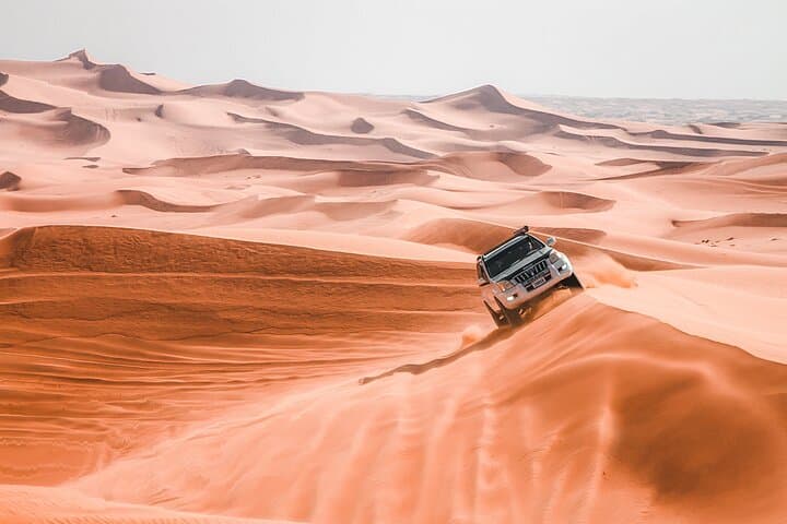 Evening Desert Safari Dubai — 4-Hour Dune Bashing, Camel Ride & Sandboarding photo 3
