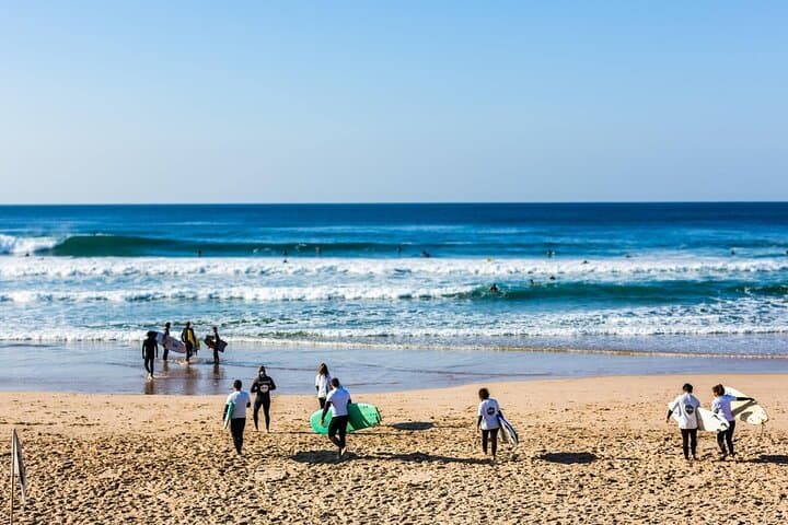 Group Surf Lesson in Costa da Caparica — Beginner Surfing with Local Instructors