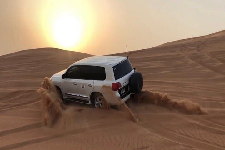 Dubai Desert Safari: Evening Dune Bashing, Camel Ride & Sandboarding Adventure