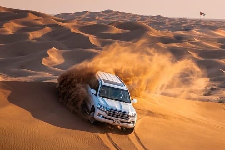 Morning Red Dunes Safari: Camel Ride, Dune Bashing & Sandboarding in Lahbab photo 2