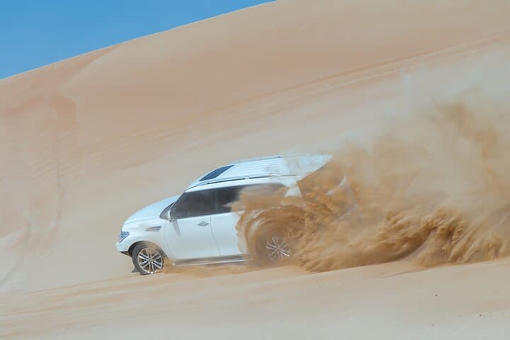 Sunset-to-Starlight Abu Dhabi Desert Safari: Dune Bashing, Quad Biking & Camp Experience