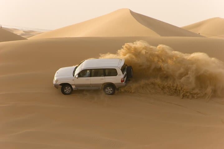 Evening Desert Safari Abu Dhabi — Dune Bashing, Sandboarding, Camel Rides & BBQ photo 2