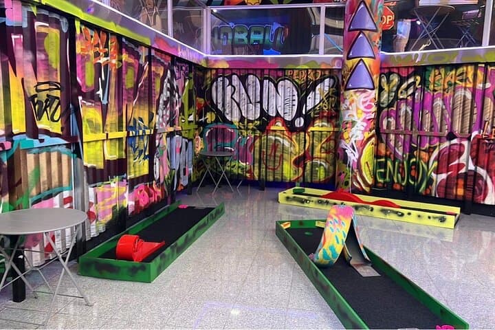 Glow-and-Putt: Porto Indoor Mini Golf with Neon Bar