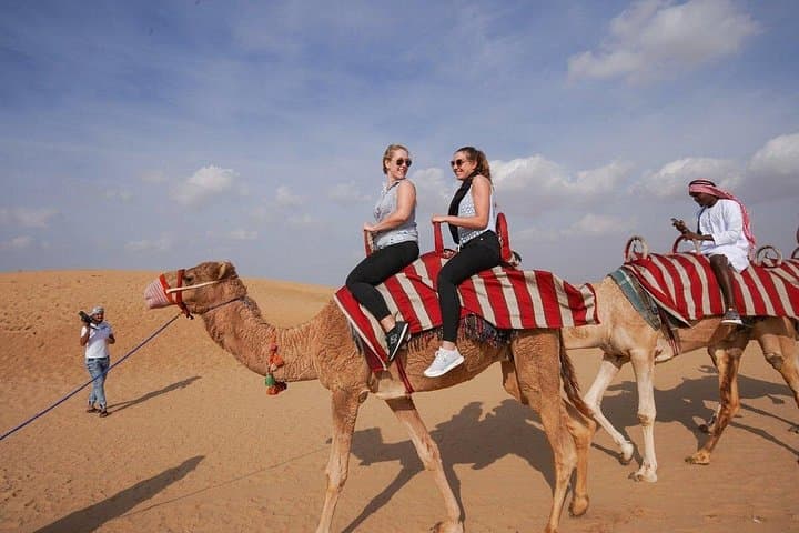 Sunset Dunes to Desert Camp: Abu Dhabi Desert Safari with Camel Rides & BBQ