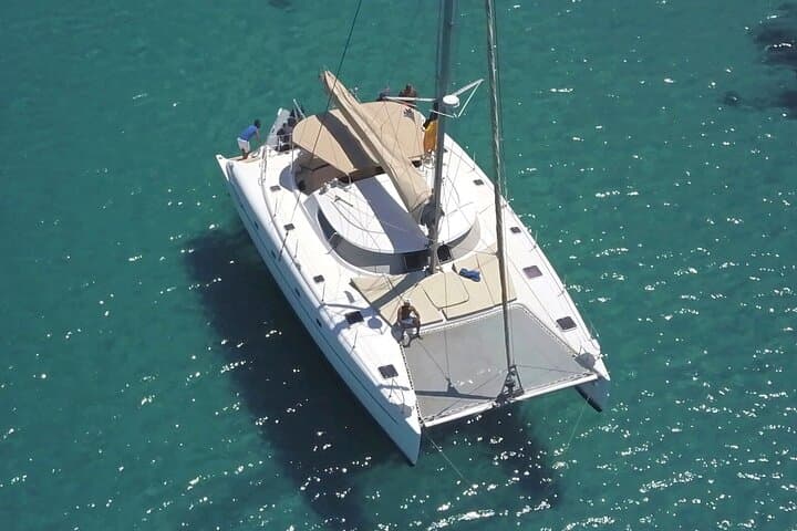 Sunset Sail to Rhenia: Mykonos Private Catamaran with Dinner & Open Bar