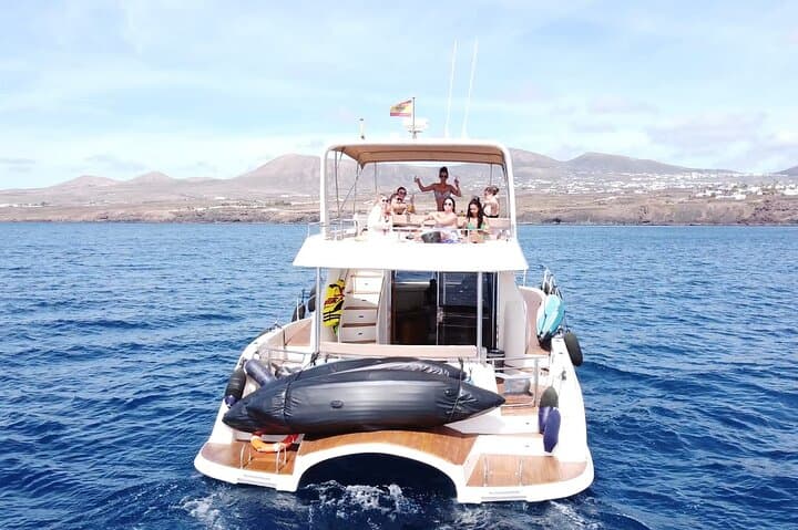 Sailing Lanzarote: Puerto del Carmen Catamaran with Snorkel, SUP & Banana Boat