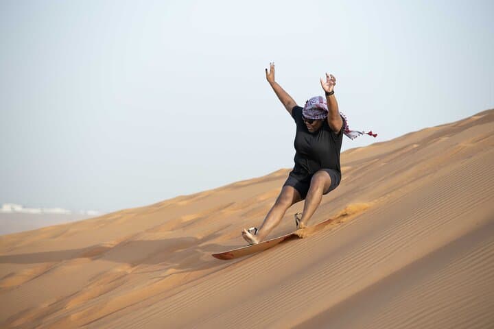 Dubai Red Dunes Half-Day Safari: Dune Bashing, Sandboarding, Camel & Falcon Experience photo 4
