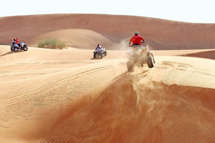 Dubai Desert Quad Bike Safari: Sandboarding, Camel Ride & Red Dunes Adventure
