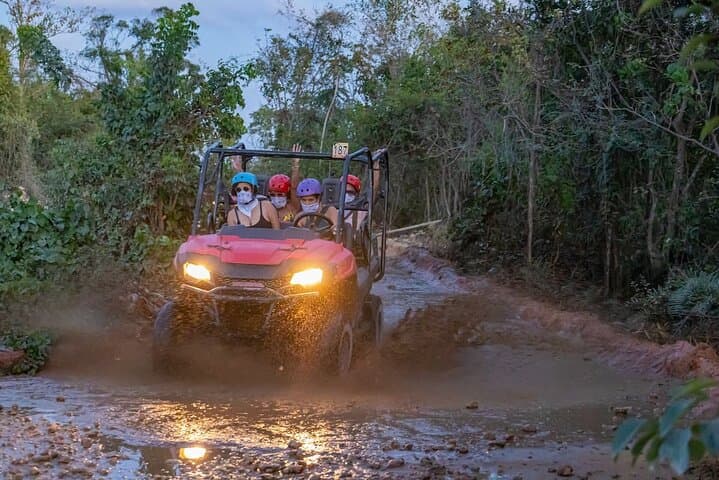 Half-Day Nightfall Buggy Tour & Cenote Swim in Punta Cana — Taino Village and Carnival photo 3