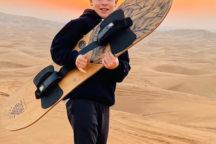 Morning Red Dune Safari Dubai: Sandboarding, Dune Bashing & Camel Ride photo 2