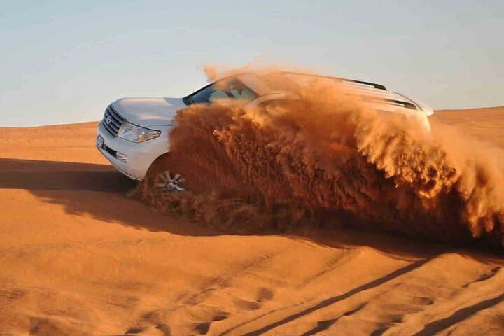 Dubai Desert Safari with BBQ Dinner: Dune Bashing, Camel Rides & Evening Shows