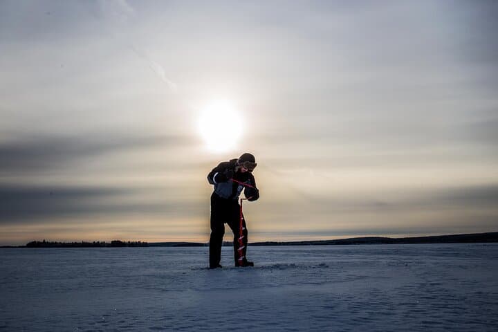 Ice Fishing in Levi: Arctic Lake Campfire Catch & Guided Experience photo 3
