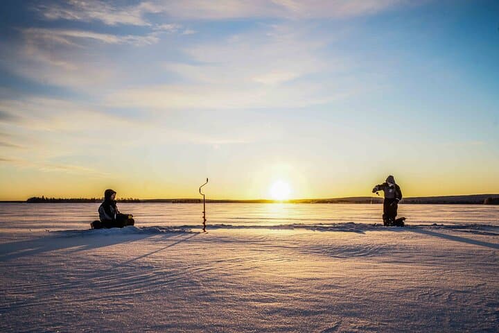 Ice Fishing in Levi: Arctic Lake Campfire Catch & Guided Experience photo 2