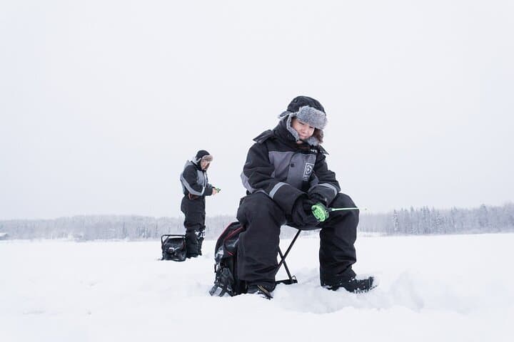 Ice Fishing in Levi: Arctic Lake Campfire Catch & Guided Experience photo 4