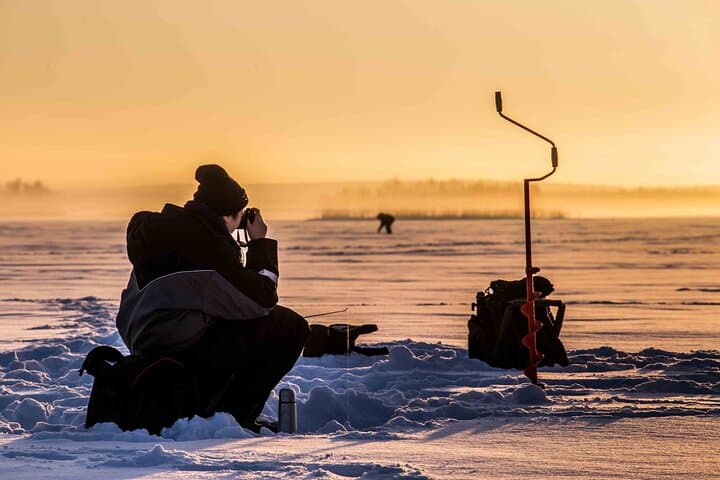 Ice Fishing in Levi: Arctic Lake Campfire Catch & Guided Experience