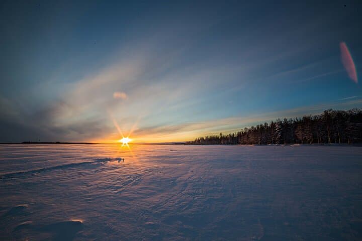 Ice Fishing in Levi: Arctic Lake Campfire Catch & Guided Experience photo 6