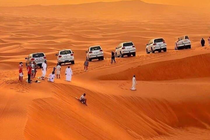 Premium Red Dunes Evening Desert Safari in Dubai — Dune Bashing, Sandboarding & BBQ photo 3