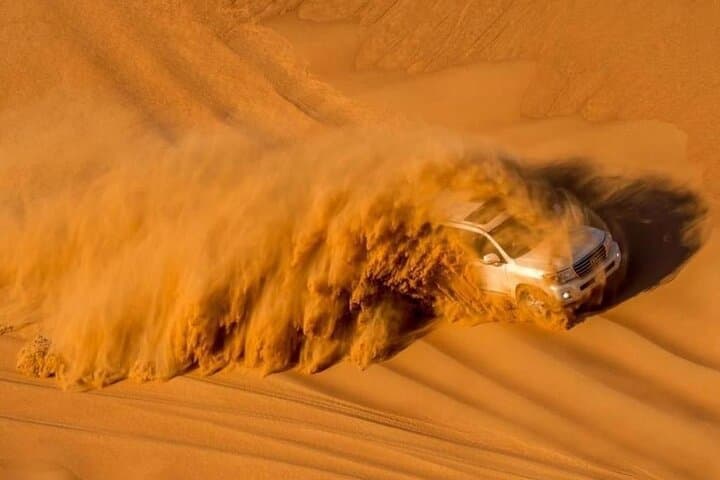 Premium Red Dunes Evening Desert Safari in Dubai — Dune Bashing, Sandboarding & BBQ photo 4