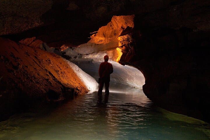 Explore Soprador do Carvalho: 4-Hour Underground Caving Experience near Coimbra