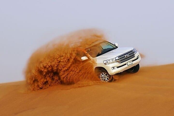 Morning Dune Explorer: Lahbab Quad Ride, Camel Trek & Dune Bashing in Dubai
