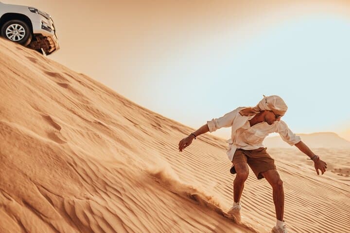 Sunrise Dune Drive in Dubai: Camel Trek, Sand Surfing & Red Dunes Photo Stops photo 2