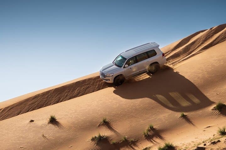 Sunrise Dune Drive in Dubai: Camel Trek, Sand Surfing & Red Dunes Photo Stops photo 3