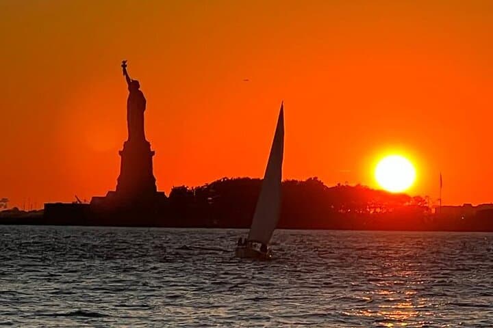 Sailing into the Sunset: NYC Skyline and Lady Liberty