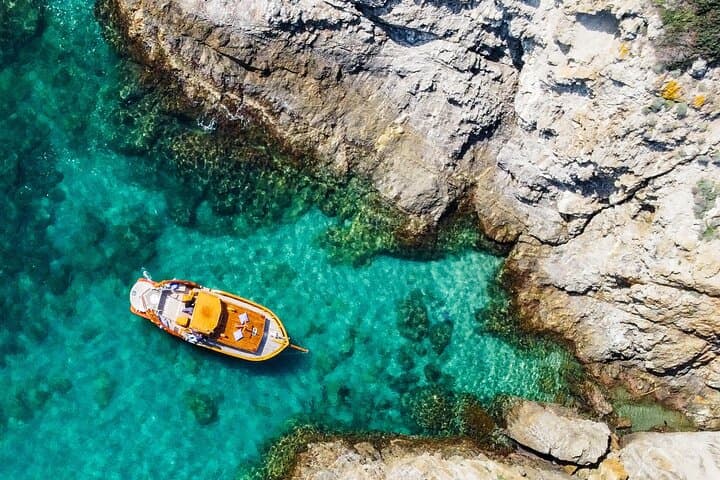 Sunset Aboard a Vintage Gozzo: Private Elba Island Coastal Cruise