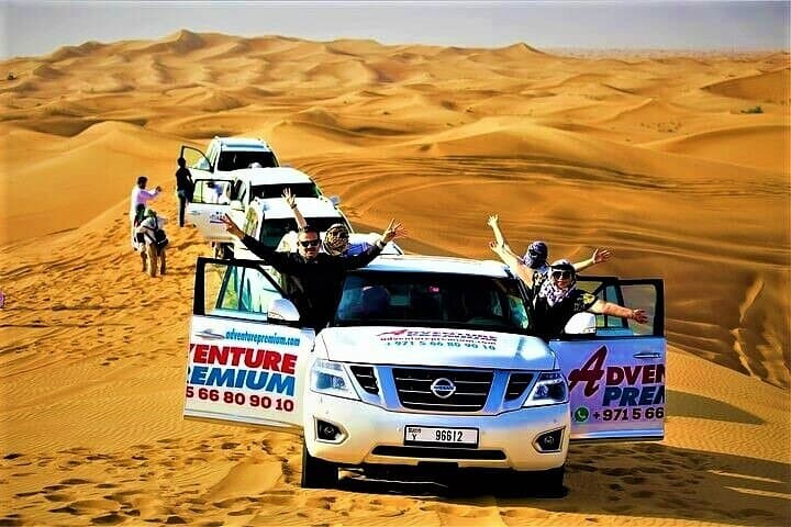 Dubai Red Dunes Sunset Safari: Dune Bashing, Camel Ride & BBQ Experience