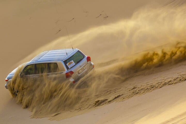 Qatar Desert Sunset: Camel Ride, Dune Bashing & Arabic Carpet Tea Experience