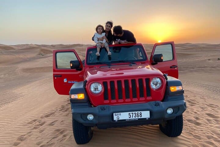 Evening Flip-Top Jeep Desert Safari in Dubai: Dune Bashing, Camel Ride & BBQ