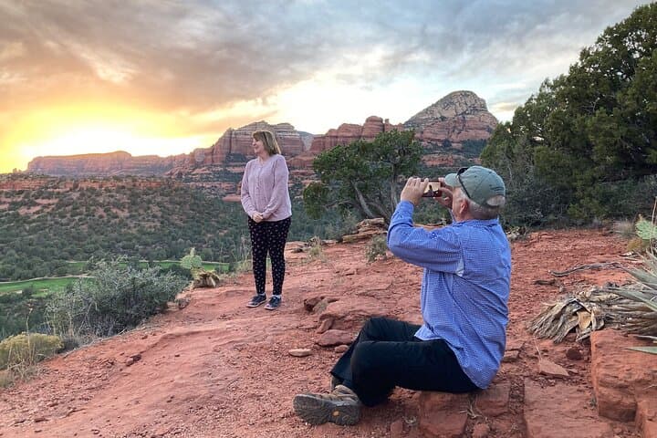 Sunset photoshoot on Sedona red rocks capturing golden sky