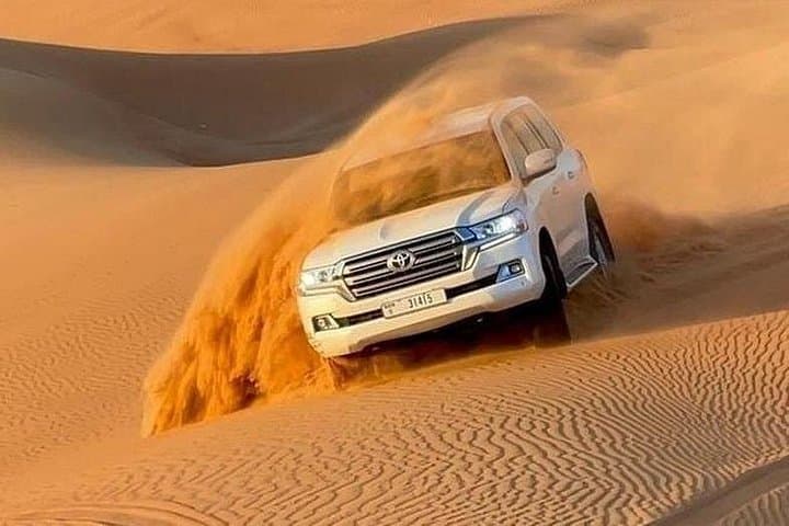 Evening Desert Safari Dubai: Camel Rides, Dune Bashing & BBQ Under Arabian Skies photo 1